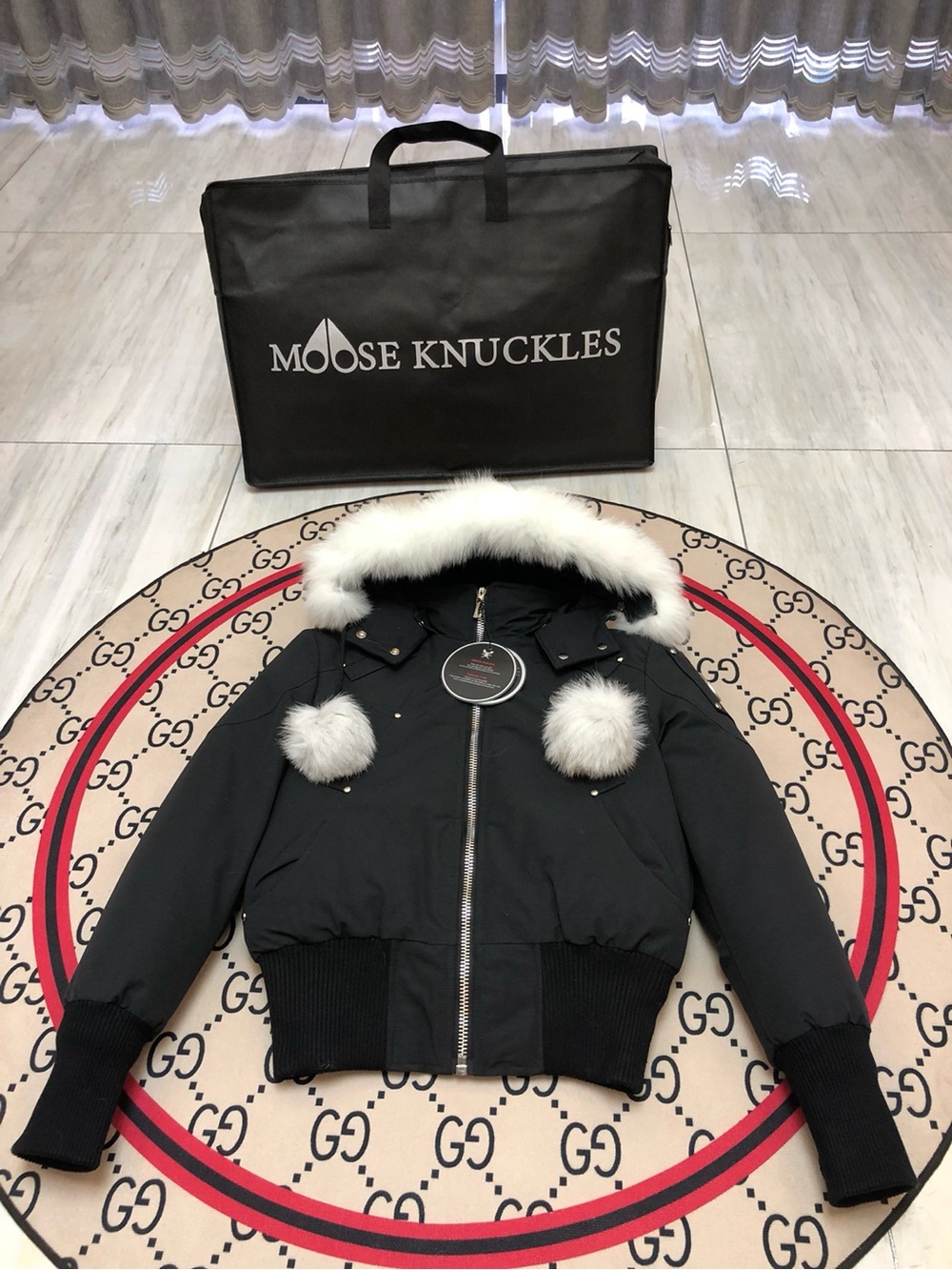 Moose Knuckles Black Bomber with Fur-Trim Hood and Pom-Pom Accents